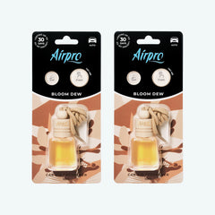Front view of Airpro Bloom Dew 10ml glass bottle car air freshener in its premium retail blister packaging with a natural beechwood cap and hanging rope.