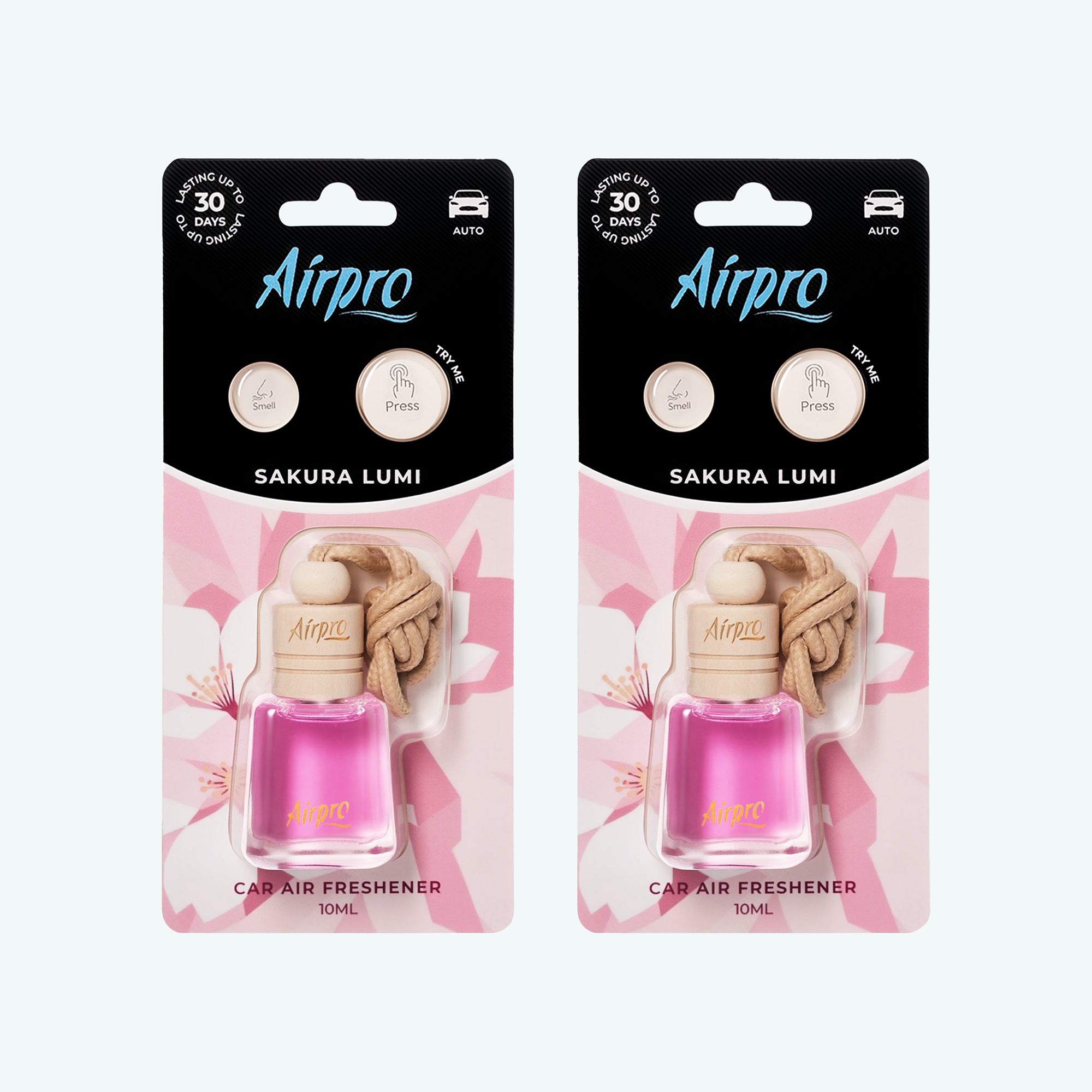 Front view of Airpro Sakura Lumi 10ml glass bottle car air freshener in its premium retail blister packaging with a natural beechwood cap and hanging rope.